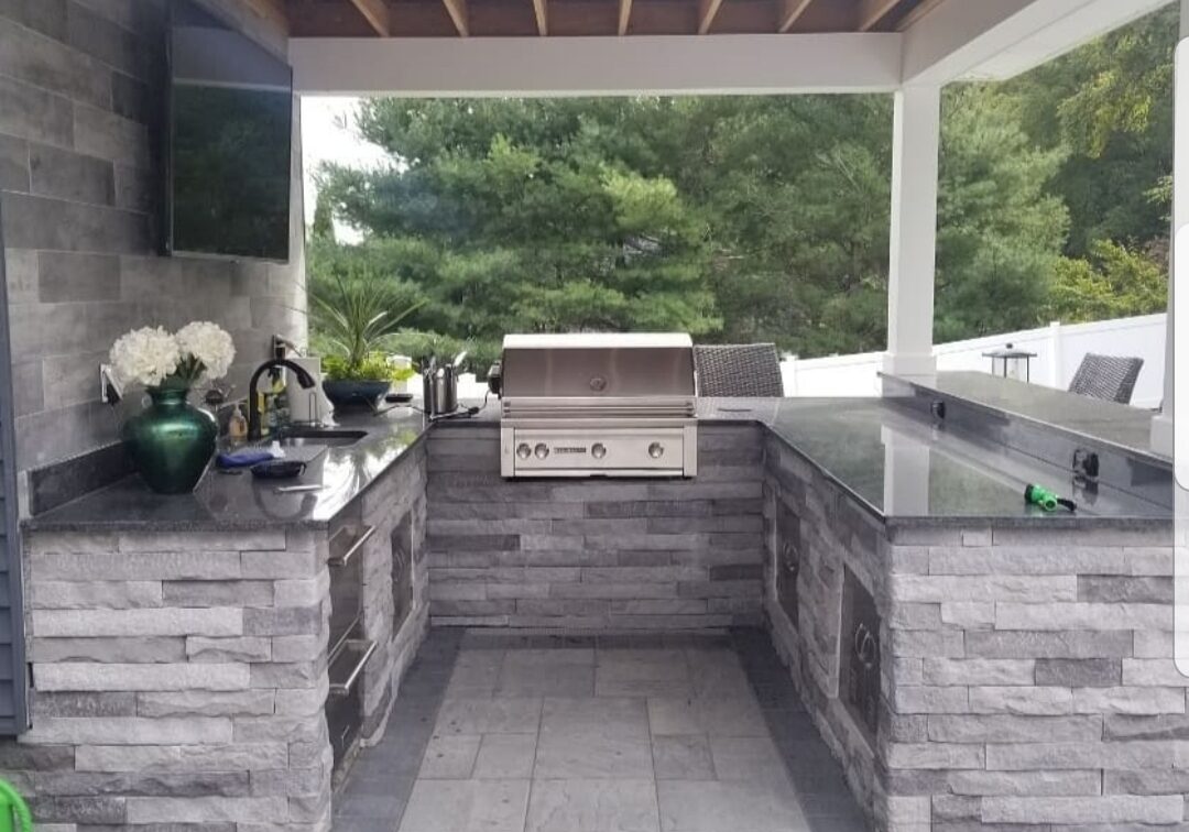 outdoor kitchen by lawn escapes